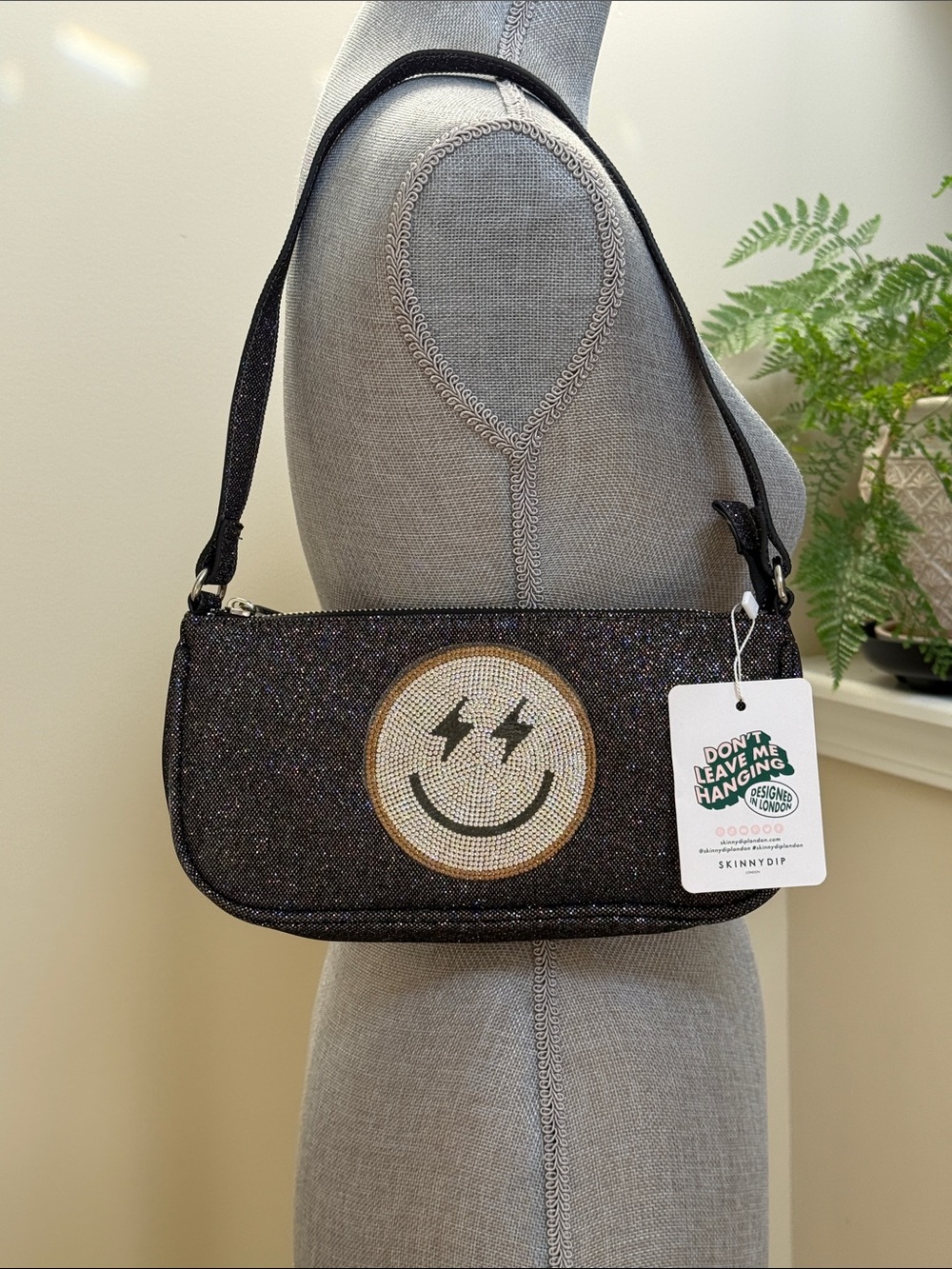 Black Glitter Smiley Shoulder Bag. Smiley face with a glitter body.